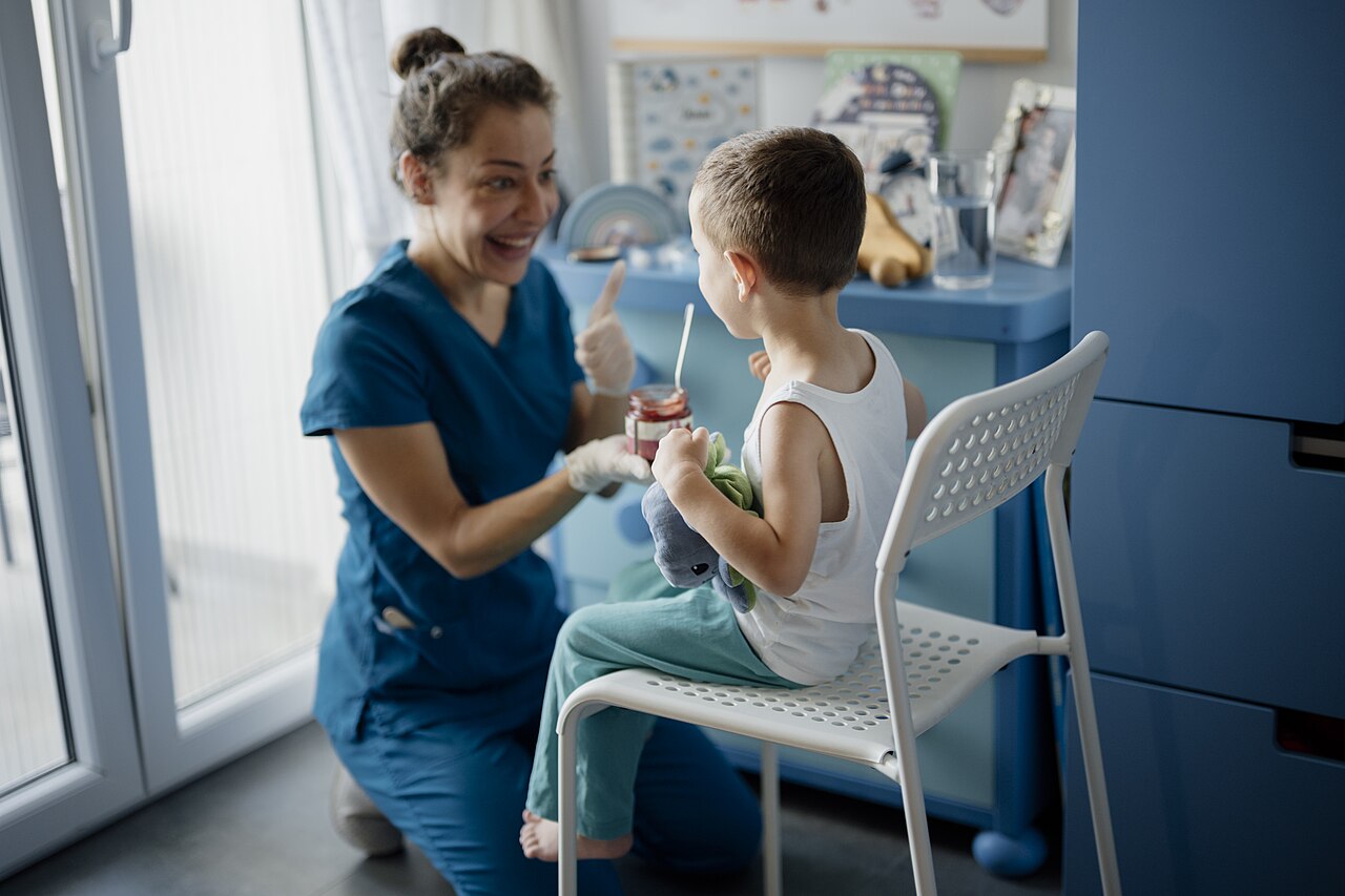 Smiling dentist caring for a child